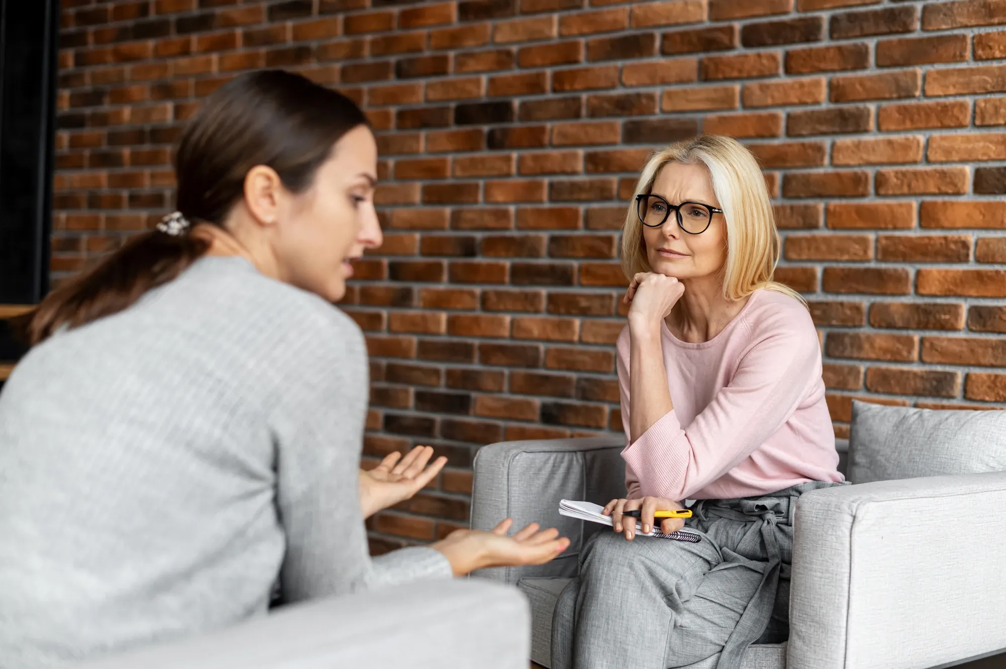 therapist and client sitting in chairs